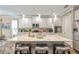 Spacious kitchen with a large island, white cabinets, stainless appliances and modern pendant lighting at 3532 Wicket Field Rd, Lutz, FL 33548
