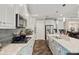 Open concept kitchen with a large island, stainless steel appliances, and modern design at 3532 Wicket Field Rd, Lutz, FL 33548