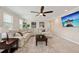 Cozy living room with a large sectional sofa, coffee table, and a wall-mounted TV at 3532 Wicket Field Rd, Lutz, FL 33548