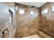 This spacious walk-in shower features a shower head, handheld shower, built-in shelving, and a shower bench at 3532 Wicket Field Rd, Lutz, FL 33548