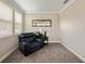Cozy sitting area with a comfortable leather recliner, a side table and a window with natural light at 3532 Wicket Field Rd, Lutz, FL 33548
