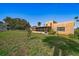 View of the backyard, and the screened in patio area at 43 Edgewater Dr, Dunedin, FL 34698