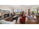 Bright living room with hardwood floors, fireplace, and a unique exterior door at 43 Edgewater Dr, Dunedin, FL 34698