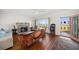 Bright living room with hardwood floors, fireplace, and waterfront view at 43 Edgewater Dr, Dunedin, FL 34698