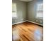 Bedroom with hardwood floors, neutral walls and natural light from the windows at 4634 Iris N St, St Petersburg, FL 33714