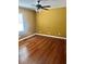 Spacious bedroom with glossy wood floors, a large window, and neutral colored walls at 4634 Iris N St, St Petersburg, FL 33714