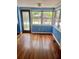Bright sunroom featuring beautiful hardwood floors, lots of natural light, and blue walls at 4634 Iris N St, St Petersburg, FL 33714