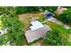 Beautiful aerial view of property featuring large backyard, patio with fire pit, and carport at 4901 Taylor N St, St Petersburg, FL 33714