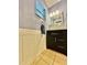 Traditional bathroom featuring vanity with dark wood cabinet, mirror, and decorative backsplash at 4901 Taylor N St, St Petersburg, FL 33714