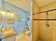 Stylish bathroom with beach decor, tiled shower, granite-topped vanity, and modern toilet at 4901 Taylor N St, St Petersburg, FL 33714