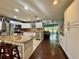 Spacious kitchen featuring white cabinets, granite countertops, stainless steel appliances, and an island with stools at 4901 Taylor N St, St Petersburg, FL 33714