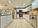 Bright kitchen with stainless steel appliances, white cabinetry, tile backsplash, and plenty of counter space at 4901 Taylor N St, St Petersburg, FL 33714