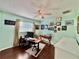 Inviting home office with hardwood floors, ceiling fan, window, and neutral paint at 4901 Taylor N St, St Petersburg, FL 33714