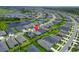 Aerial view of a neighborhood featuring pond views, green spaces, and well-maintained homes and lawns at 5415 Limelight Dr, Apollo Beach, FL 33572