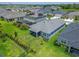 Landscaped backyard with a screened lanai and lush lawns at 5415 Limelight Dr, Apollo Beach, FL 33572