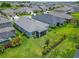 Home's landscaped backyard features a screened lanai, fence and lush lawn at 5415 Limelight Dr, Apollo Beach, FL 33572