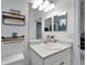 Bright bathroom with a stylish vanity, a decorative mirror, and modern fixtures at 5415 Limelight Dr, Apollo Beach, FL 33572