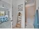 Modern bathroom featuring a walk-in shower and decorative wooden towel ladder at 5415 Limelight Dr, Apollo Beach, FL 33572