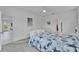 Light and airy bedroom features coastal decor, a ceiling fan, and easy access to an adjoining room at 5415 Limelight Dr, Apollo Beach, FL 33572