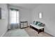 Bright bedroom featuring a changing table, window and cushioned bench at 5415 Limelight Dr, Apollo Beach, FL 33572