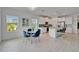Bright open concept kitchen featuring an island, modern lighting, and a dining area at 5415 Limelight Dr, Apollo Beach, FL 33572