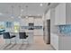 Bright kitchen featuring an island, stainless appliances, and modern countertops at 5415 Limelight Dr, Apollo Beach, FL 33572