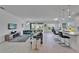 Bright, open-concept living area seamlessly flows into the kitchen, complete with modern decor at 5415 Limelight Dr, Apollo Beach, FL 33572