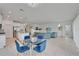 Open-concept living space with kitchen, dining area, and living room, perfect for entertaining at 5415 Limelight Dr, Apollo Beach, FL 33572