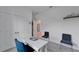Office area includes a desk, comfortable seating, and ample closet space for storage at 5415 Limelight Dr, Apollo Beach, FL 33572