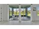 Screened patio featuring comfortable seating and a view of the well-maintained backyard at 5415 Limelight Dr, Apollo Beach, FL 33572
