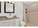 Updated bathroom features granite countertop vanity, tiled shower with a built-in niche, and stylish fixtures at 5473 Bayshore Dr, Seminole, FL 33772