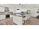 A beautifully designed kitchen featuring a large island with seating, stainless steel appliances, and ample cabinetry at 5473 Bayshore Dr, Seminole, FL 33772