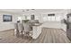 Bright, open kitchen with an island, granite countertops, stainless steel appliances, and decorative backsplash at 5473 Bayshore Dr, Seminole, FL 33772