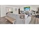 Cozy living room with modern decor, wood floors, and access to dining room at 5473 Bayshore Dr, Seminole, FL 33772