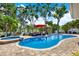 Gorgeous backyard with private pool, spa, and patio seating with a serene water view at 5473 Bayshore Dr, Seminole, FL 33772