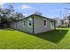Freshly renovated home features a spacious backyard with new sod and exterior paint at 5707 N 20Th St, Tampa, FL 33610