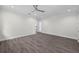 Large bedroom with hardwood floors, recessed lighting, and a ceiling fan for comfort at 5707 N 20Th St, Tampa, FL 33610
