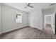 Cozy bedroom with a ceiling fan, window, and a closet offering efficient space utilization at 5707 N 20Th St, Tampa, FL 33610