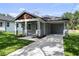 Beautifully renovated home with a covered porch, porte-cochere, and freshly installed landscaping at 5707 N 20Th St, Tampa, FL 33610
