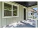 Close-up of the front porch showcases the home's entrance and architectural details at 5707 N 20Th St, Tampa, FL 33610