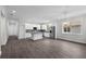 A kitchen features stainless steel appliances, an island, and white cabinetry at 5707 N 20Th St, Tampa, FL 33610