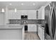 This kitchen features stainless steel appliances, an island, and mosaic tile at 5707 N 20Th St, Tampa, FL 33610