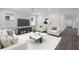 A stylish living room features contemporary furniture, a modern TV, and sleek decor at 5707 N 20Th St, Tampa, FL 33610