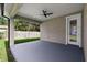 Back patio with overhead fan and a door that leads inside the house at 5707 N 20Th St, Tampa, FL 33610