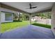 Covered patio offering a peaceful outdoor space with a fan and backyard views at 5707 N 20Th St, Tampa, FL 33610