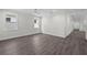 Spacious room with sleek flooring, crown molding, and bright natural light at 5707 N 20Th St, Tampa, FL 33610