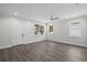 A bright room features recessed lighting, sleek flooring, windows, and a door at 5707 N 20Th St, Tampa, FL 33610