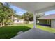 Large backyard with green grass and mature trees at 5709 N 20Th St, Tampa, FL 33610