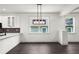 Bright dining area featuring dark wood floors and modern lighting with lots of natural light at 5709 N 20Th St, Tampa, FL 33610