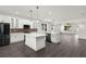 Modern kitchen with a central island, stainless steel appliances, and seamless open layout at 5709 N 20Th St, Tampa, FL 33610